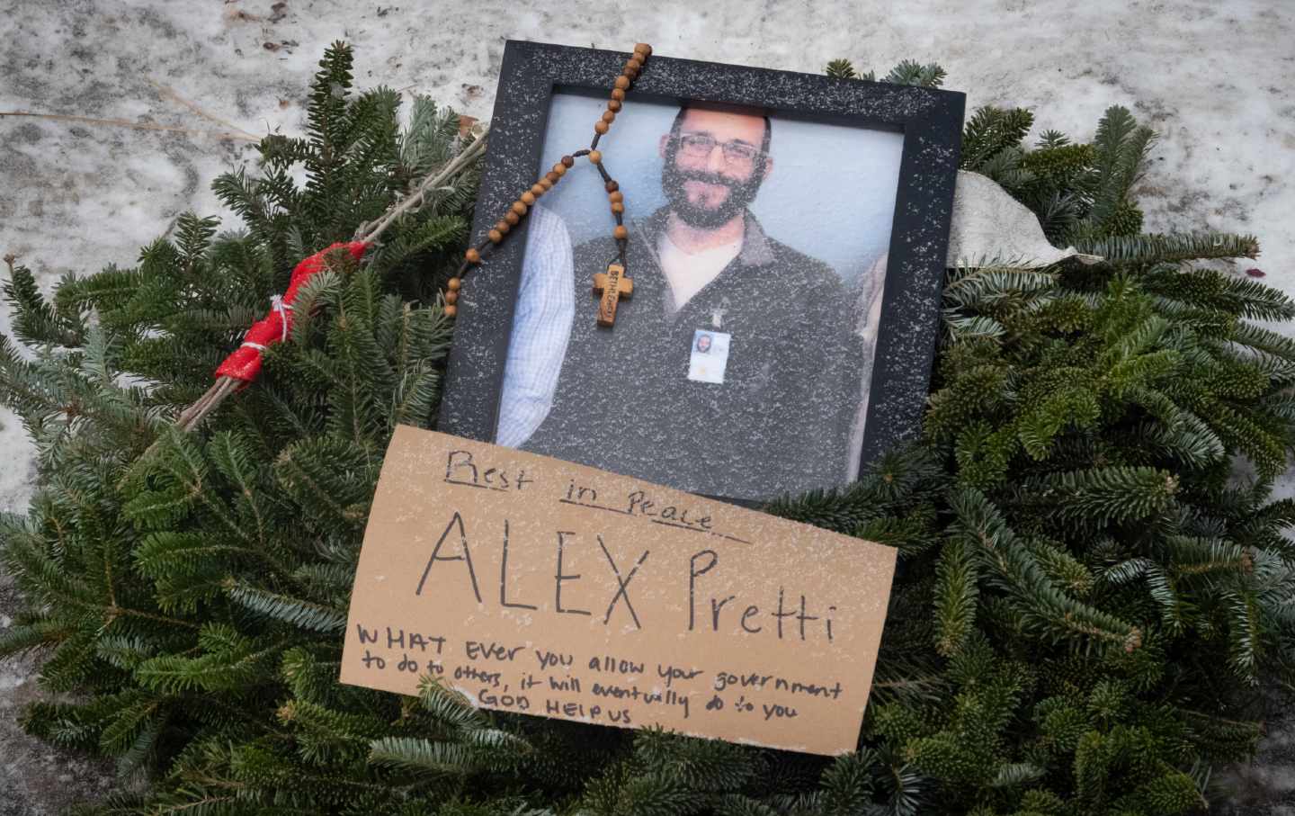 Flowers are left at a makeshift memorial in the area where Alex Pretti was shot dead a day earlier by federal immigration agents in Minneapolis, Minnesota, on January 25, 2026.