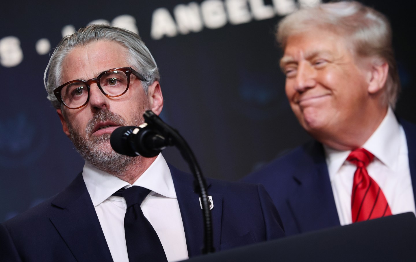 Chairman of the 2028 LA Olympics organizing committee Casey Wasserman speaks as President Donald Trump looks on during an executive order signing ceremony on August 5, 2025, in Washington, DC.