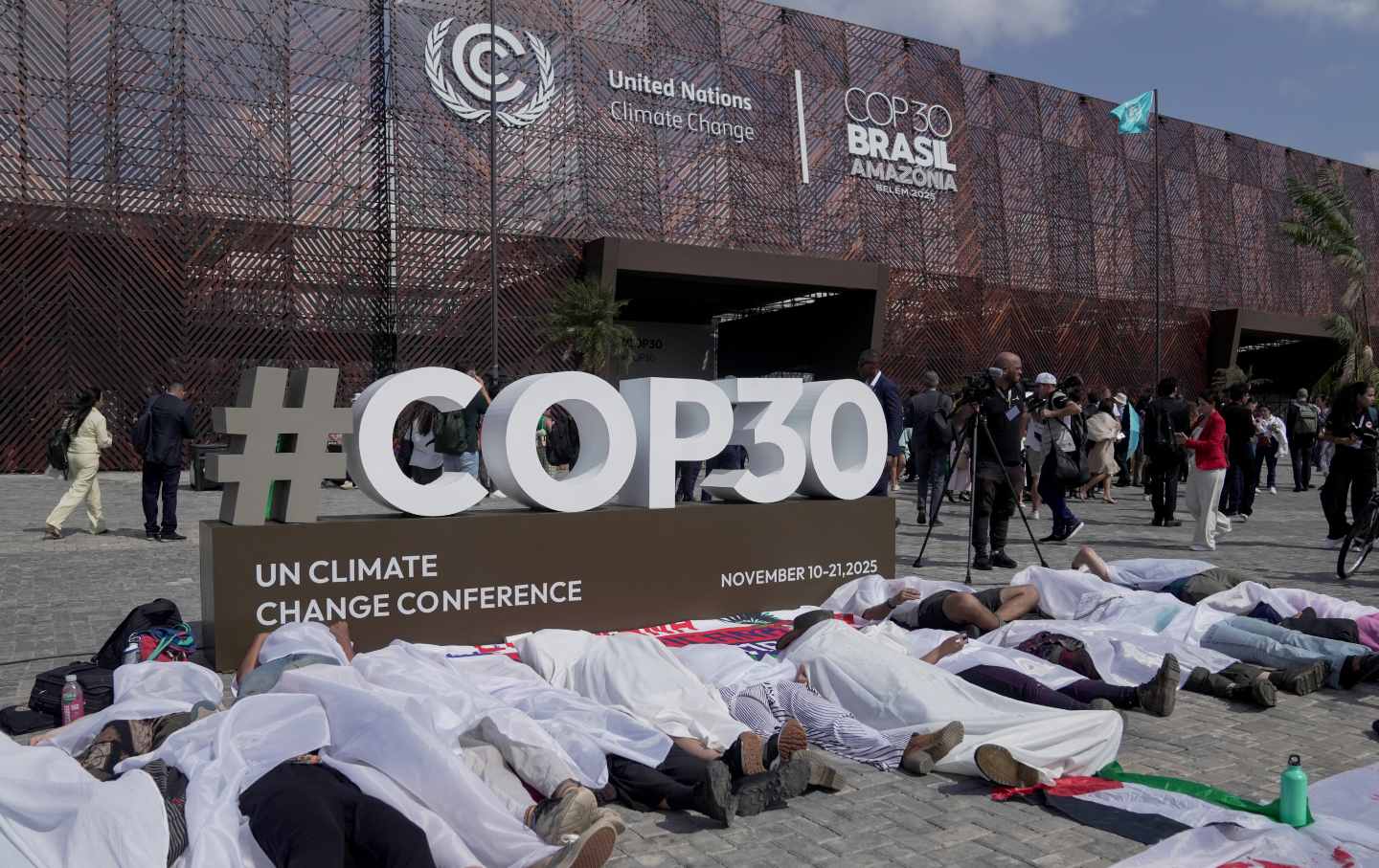 People participate in a demonstration in front of the main entrance of COP30 in Belém, Brazil, on November 10, 2025.