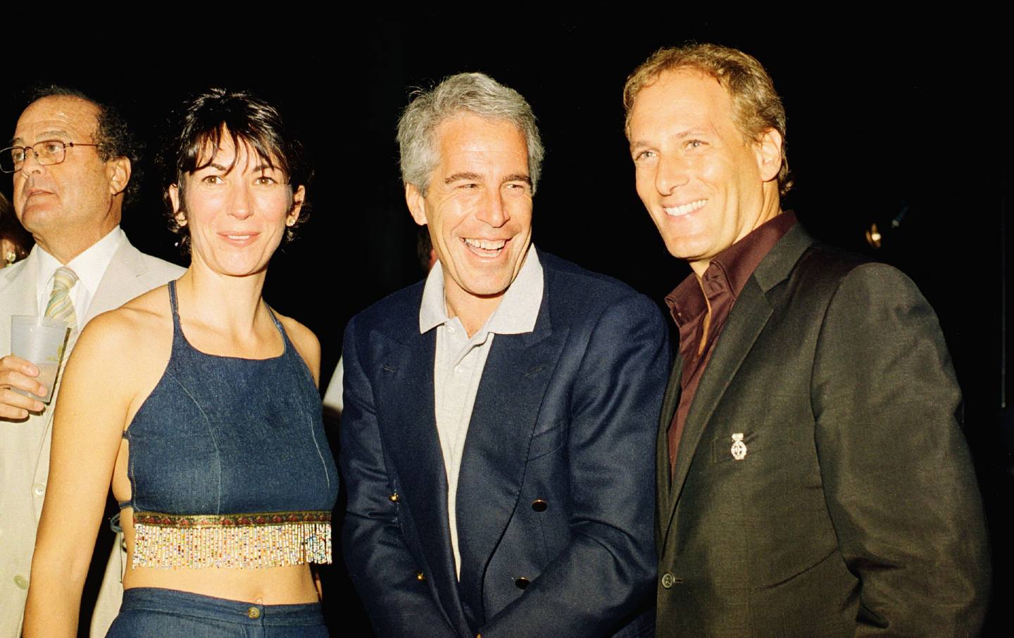 Ghislaine Maxwell, Jeffrey Epstein, and musician Michael Bolton pose for a portrait during a party at the Mar-a-Lago club, Palm Beach, Florida, February 12, 2000.