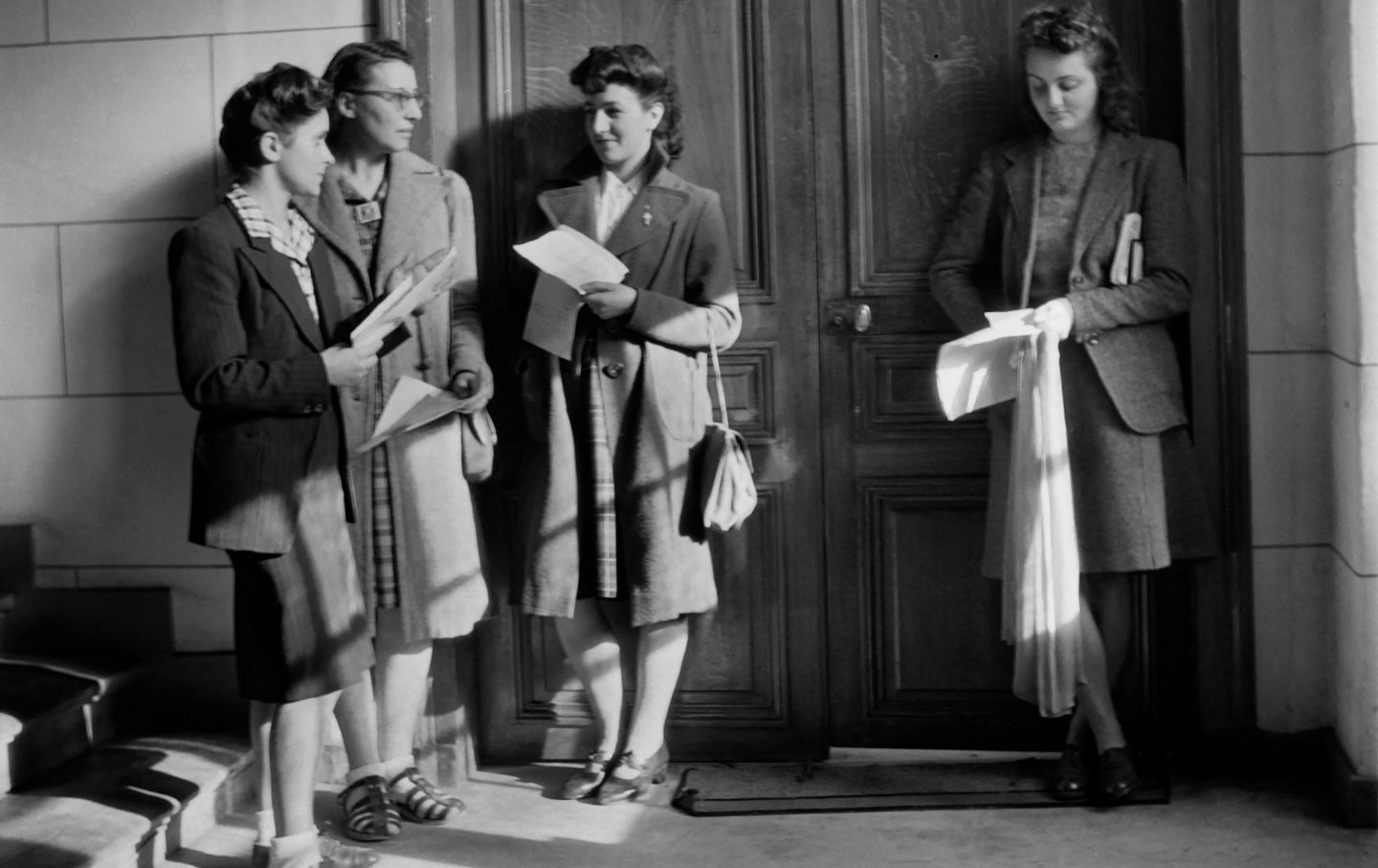 Women wait to undergo a medical check in Paris in October 1944.