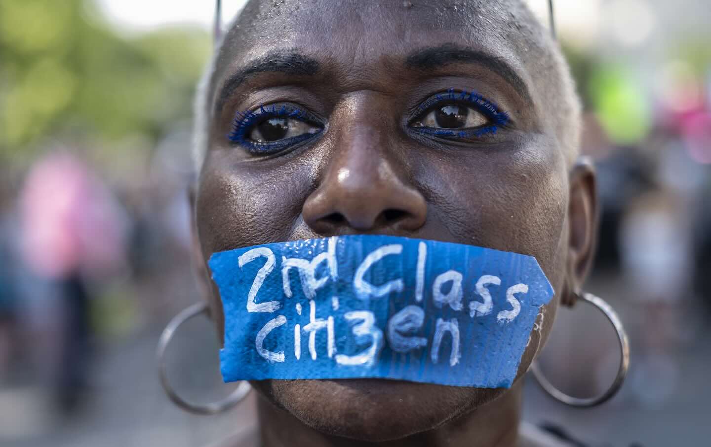 An abortion rights activist wears tape on her mouth with the words “Second Class Citizen” while protesting in front of the Supreme Court building following the announcement to the Dobbs v. Jackson Women's Health Organization ruling in Washington, DC.