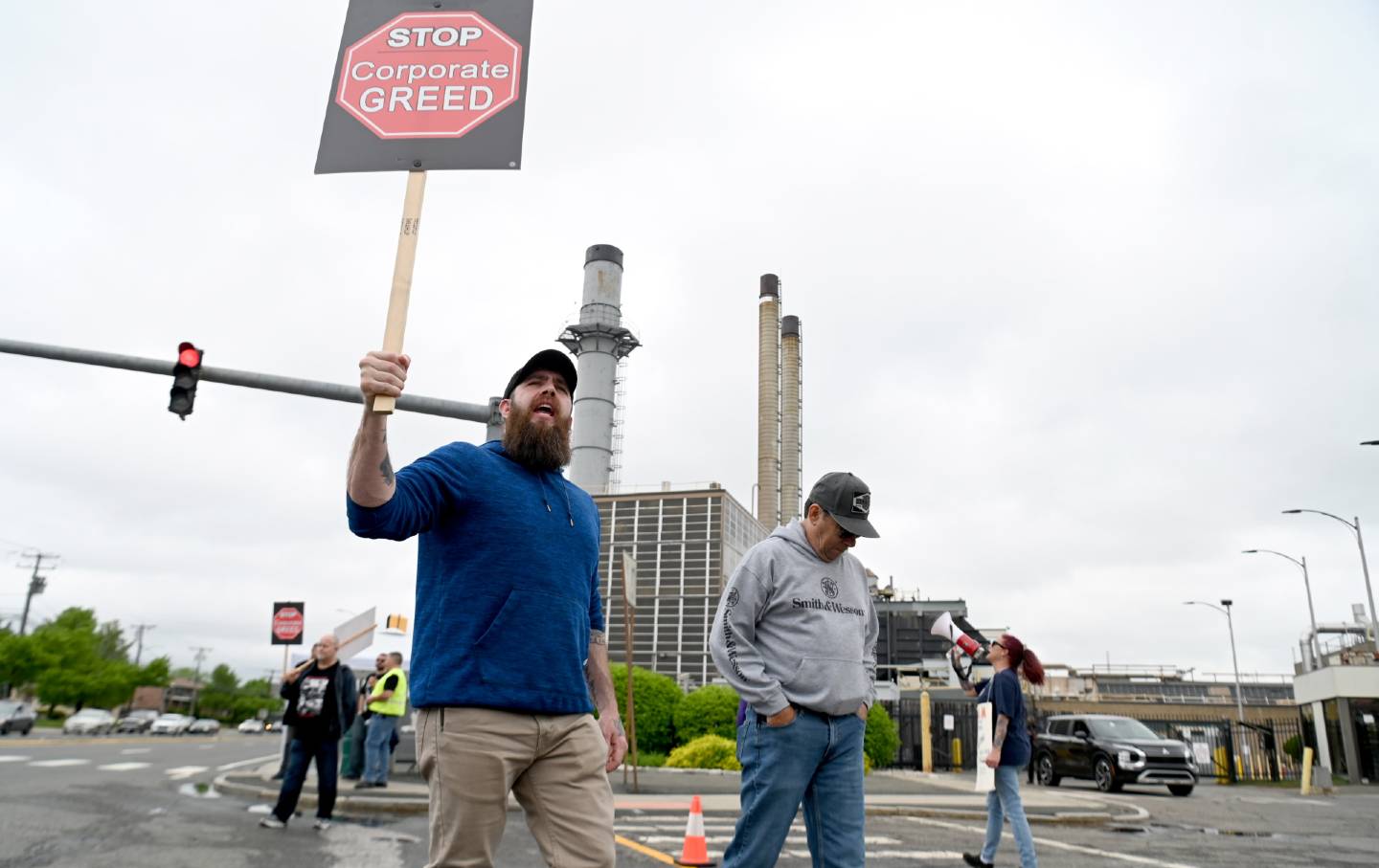 Bryan Scalia of Enfield, foreground, shouts out while on the picket line with other members of machinist local 1746 picket on day two of the machinist union strike on Tuesday, May 5, 2025, in front of Pratt &Whitney plant on Main Street in East Hartford.