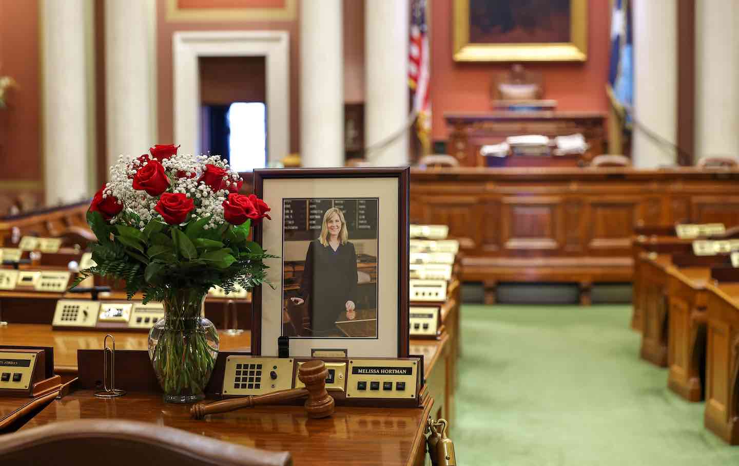 A memorial is seen on the desk of DFL State Representative Melissa Hortman in the House chambers at the Minnesota State Capitol on June 16, 2025, in St. Paul, Minnesota. Hortman and her husband, Mark Hortman, were shot at their home on June 14. DFL State Senator John Hoffman and his wife were also shot and hospitalized in a separate incident. Minnesota Governor Tim Walz said during a press conference that the shooting “appears to be a politically motivated assassination.”