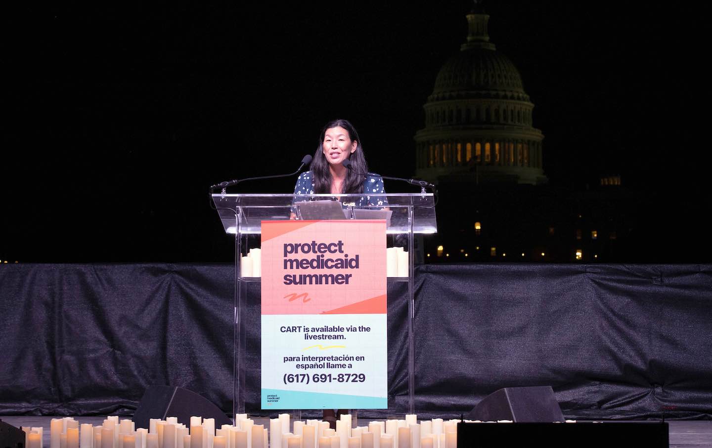Ai-jen Poo speaks as Care advocates light 8,000 candles for 80 million Americans who rely on Medicaid during a 60-hour vigil on July 23, 2025, in Washington, DC.