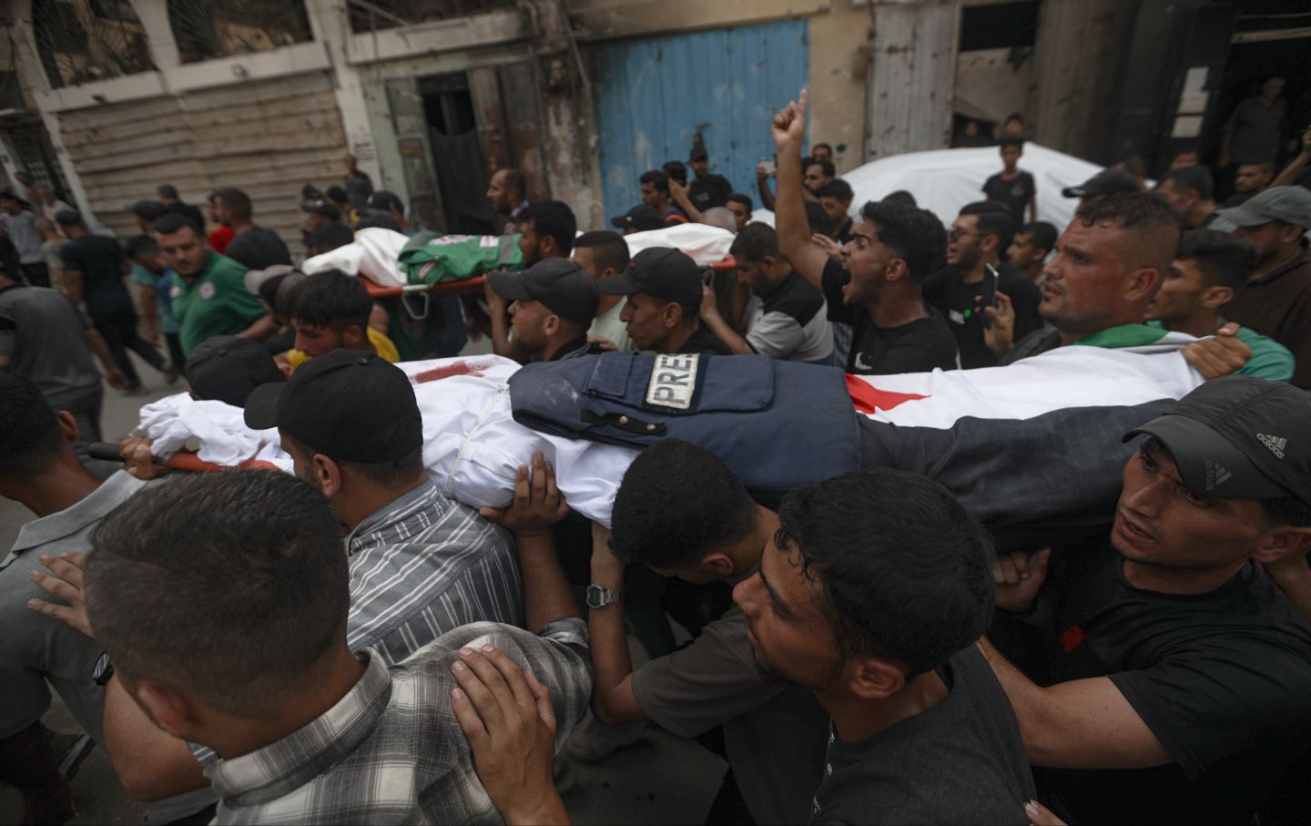 Relatives and colleagues of the Al Jazeera correspondents Anas al-Sharif and Mohamed Qraiqea, photojournalists Ibrahim Dahir and Moumin Alaywa, and assistant photojournalist Mohammed Noufal, who were killed in an Israeli airstrike on a journalists' tent near the Al-Shifa Hospital in the Gaza city center attend the funeral ceremony on August 11, 2025 in Gaza City, Gaza.
