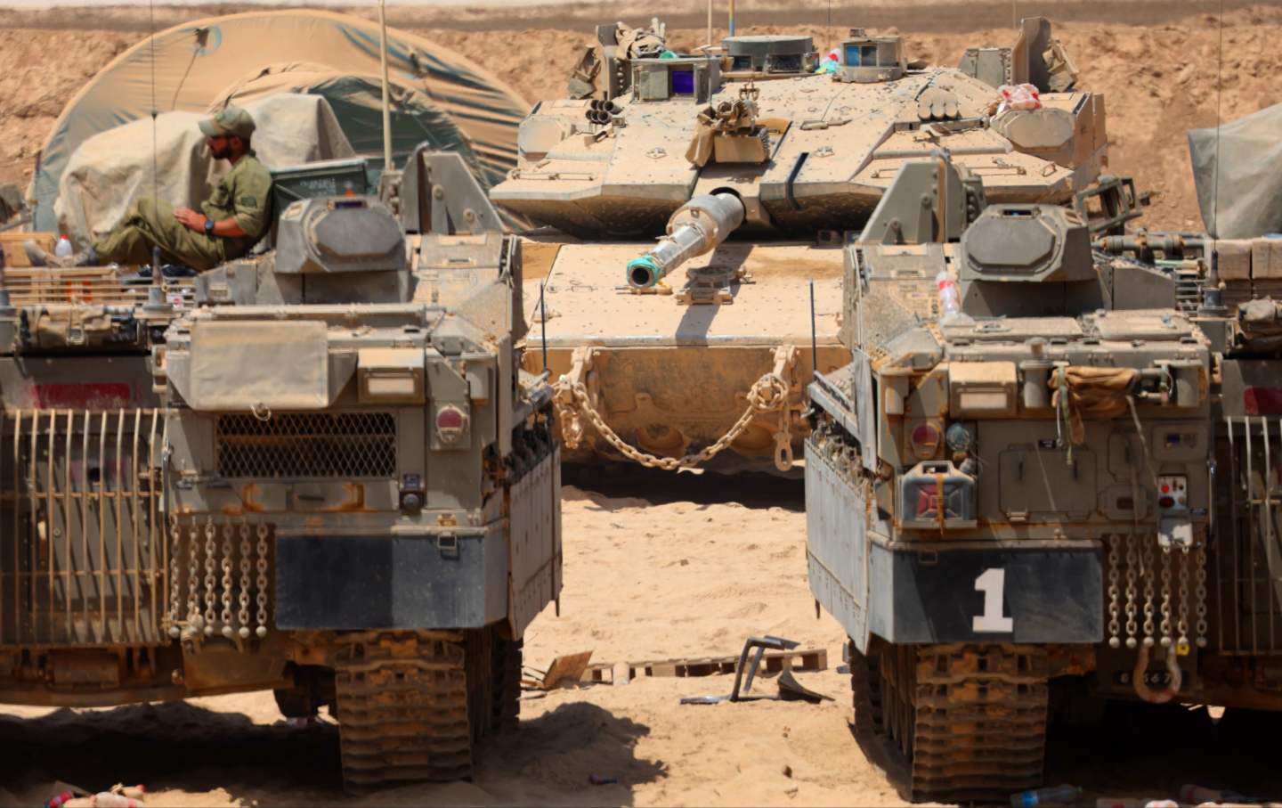 Israeli military vehicles are positioned along the border with the Gaza Strip on August 21, 2025.