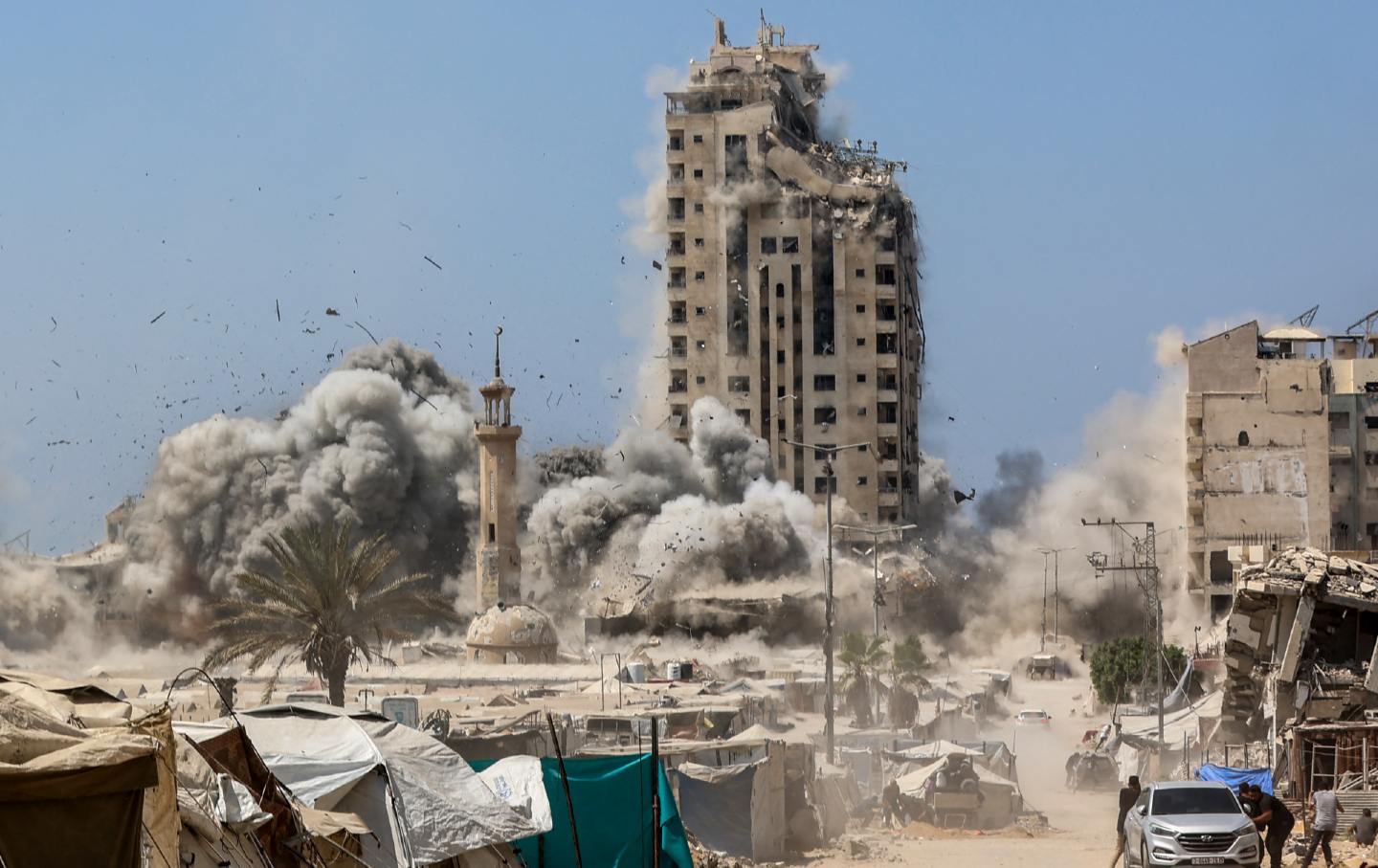 Smoke billows during Israeli strikes on the Mushtaha Tower in Gaza City on September 5, 2025.