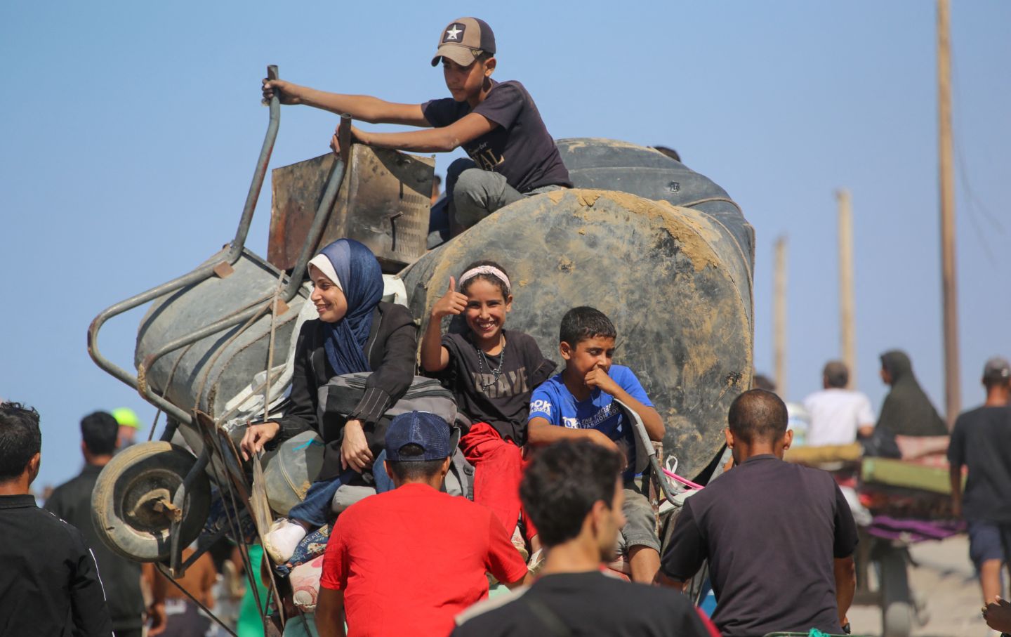 Palestinians make their way along Al-Rashid road toward Gaza City from Nuseirat in the central Gaza Strip on October 10, 2025.
