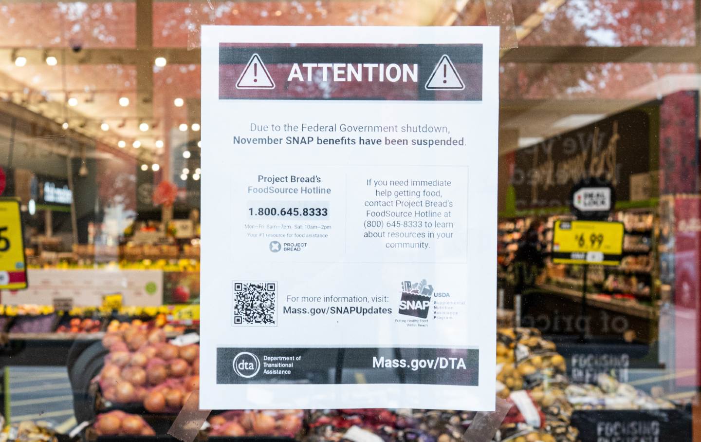 A grocery store in Dorchester, Massachusetts, warns customers that SNAP benefits have been suspended.