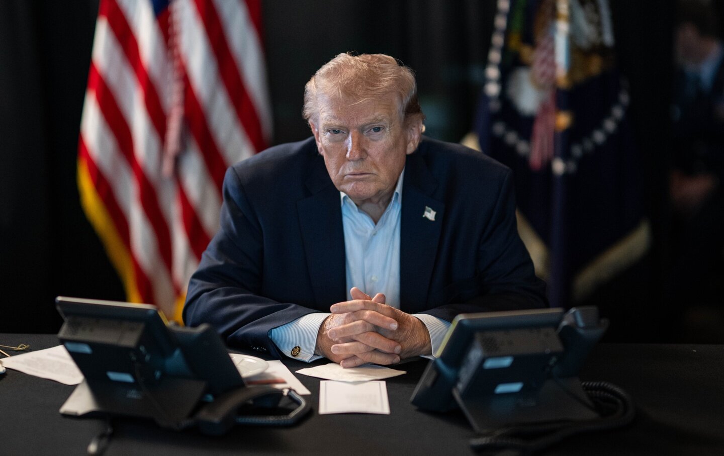 US President Donald J. Trump sits at a table monitoring military operations during Operation Epic Fury against Iran.