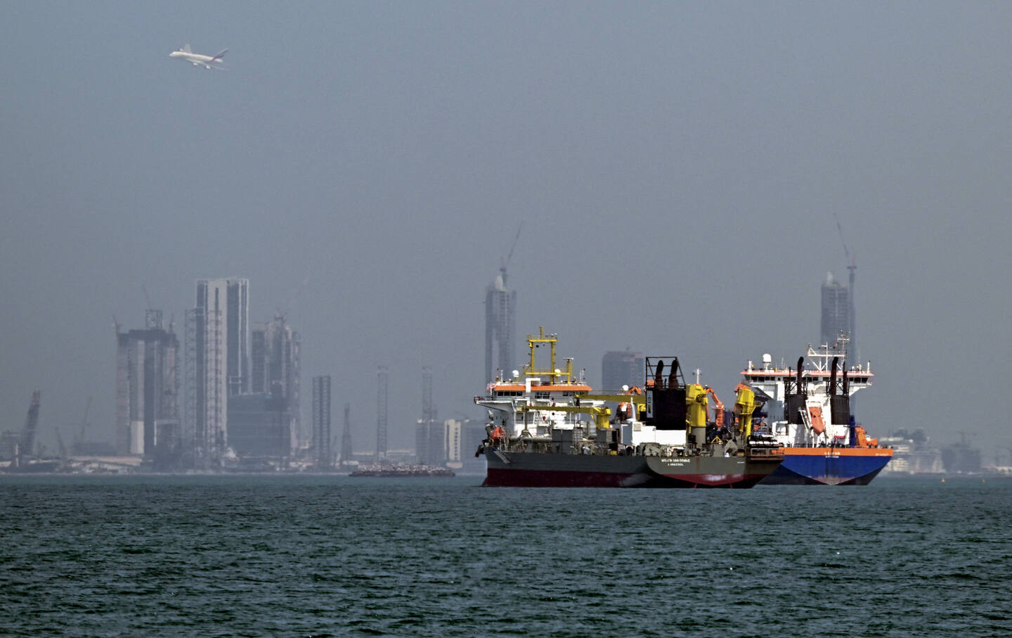 Commercial vessels are pictured offshore in Dubai on March 11, 2026.
