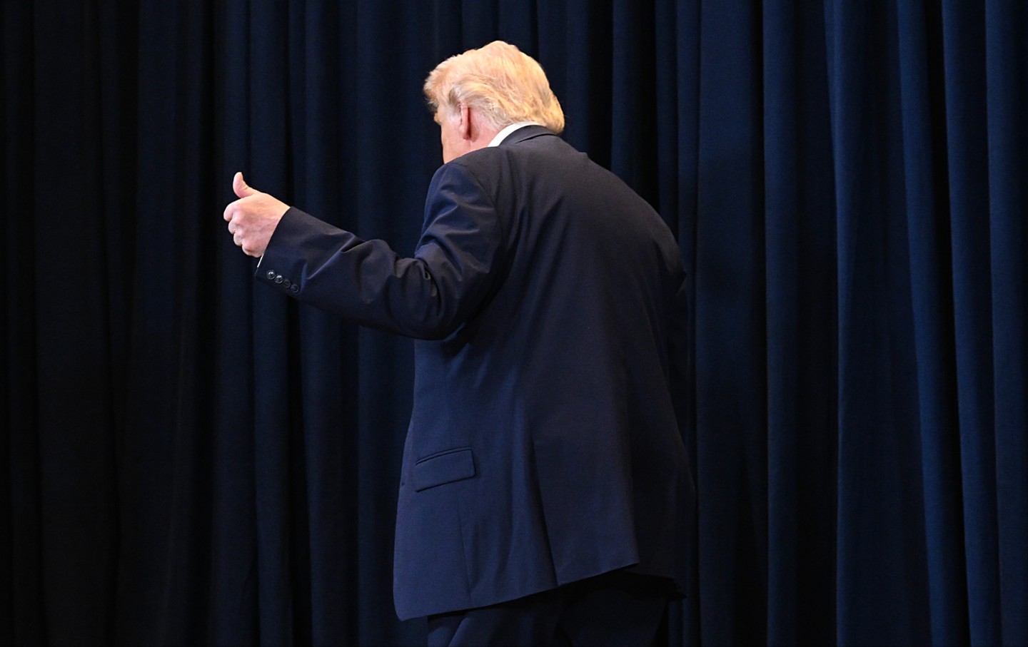 Donald Trump leaves after speaking to reporters during a news conference at Trump National Doral Miami on March 9, 2026, in Doral, Florida.