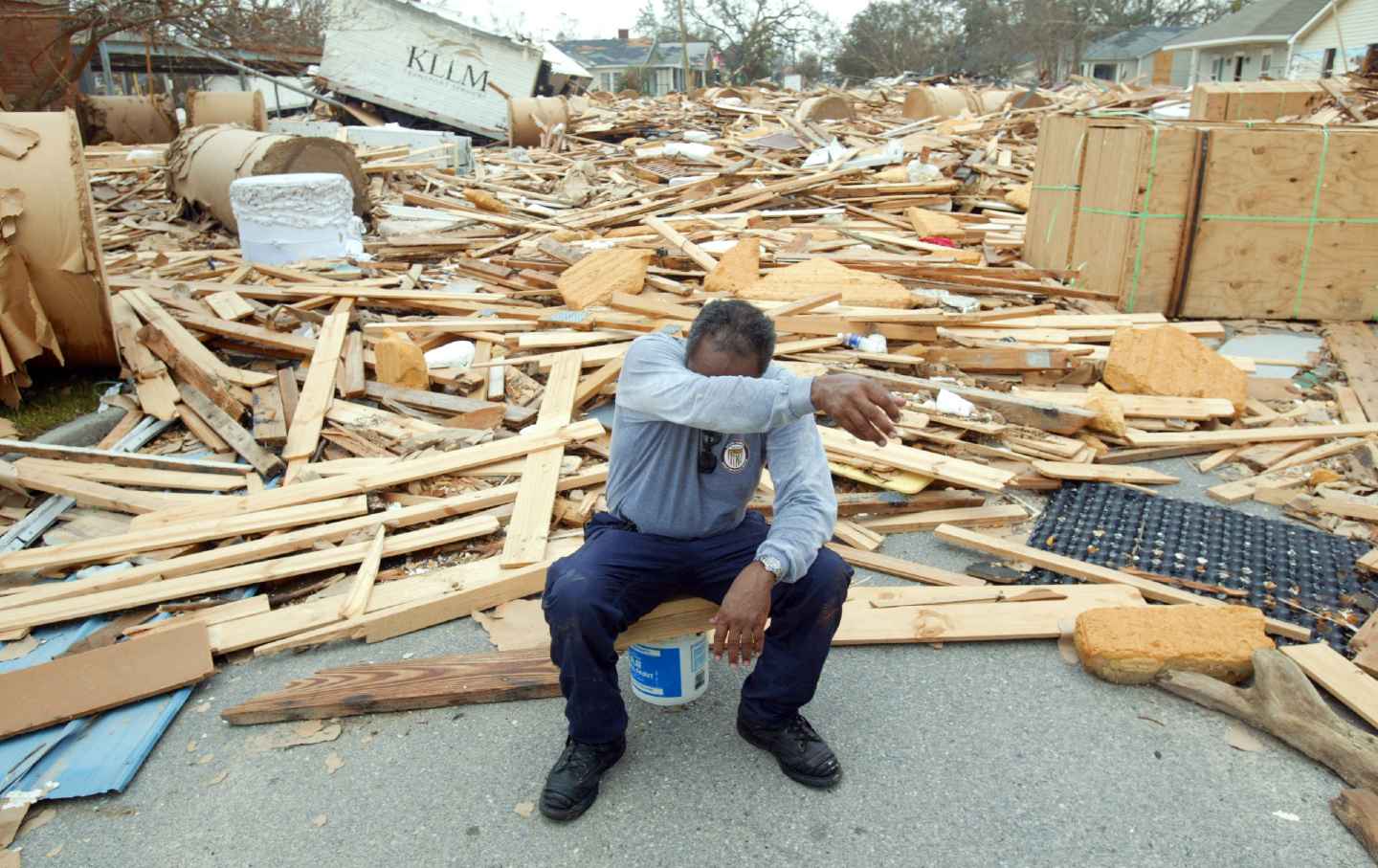 Firefighter Jerome Crenshaw wipes sweat away during a break from the recovery efforts in the aftermath of Hurricane Katrina, September 1, 2005.