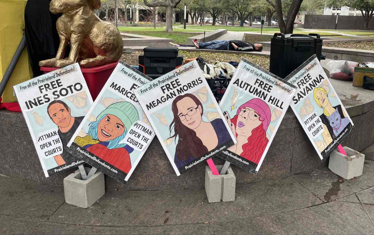 Posters supporting the Prairieland Defendants outside the courthouse in Fort Worth, Texas.