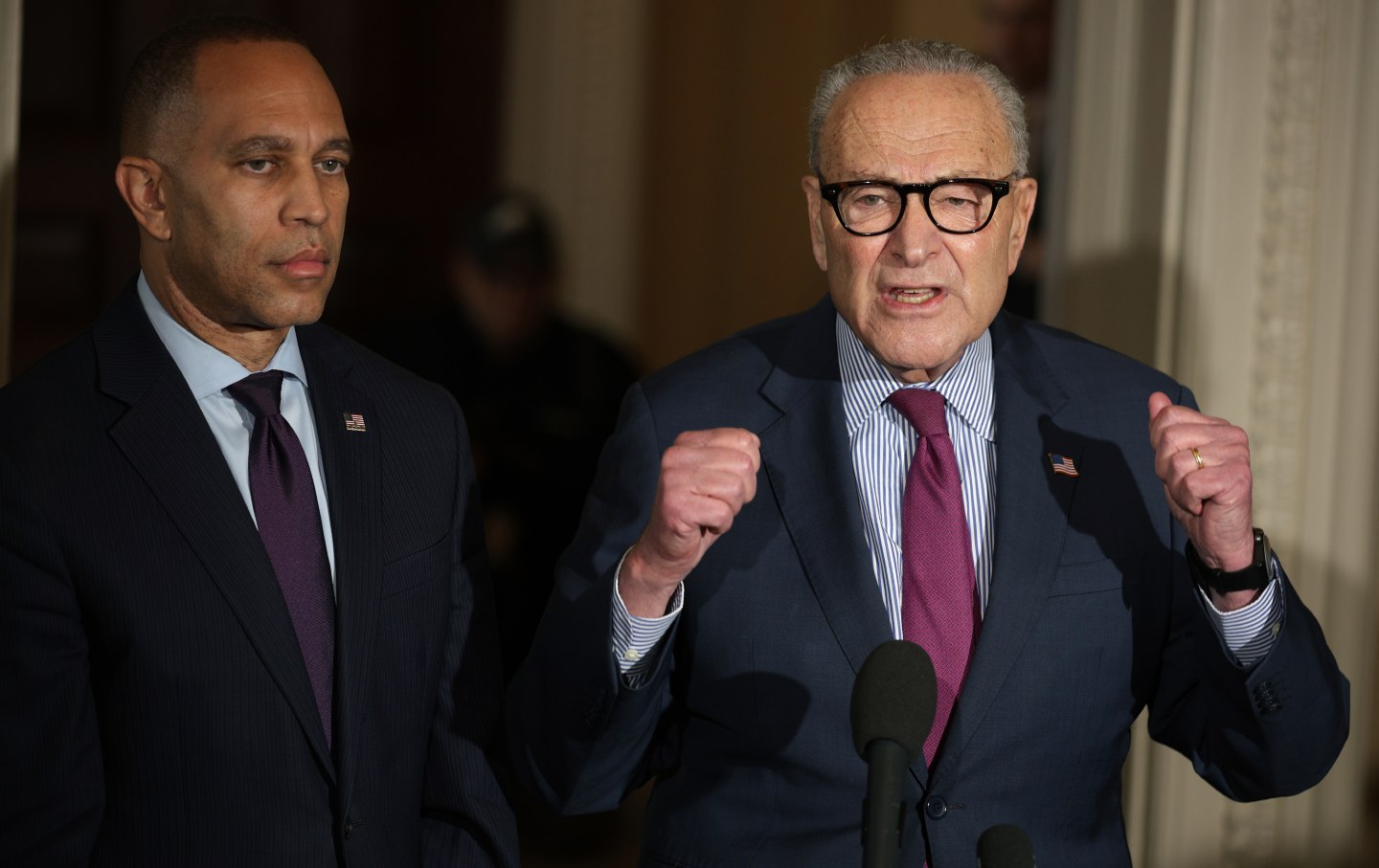 Senate minority leader Chuck Schumer (D-NY), right, and House minority leader Hakeem Jeffries (D-NY), left, brief members of the press during a news conference on the government shutdown at the US Capitol on October 16, 2025, in Washington, DC.