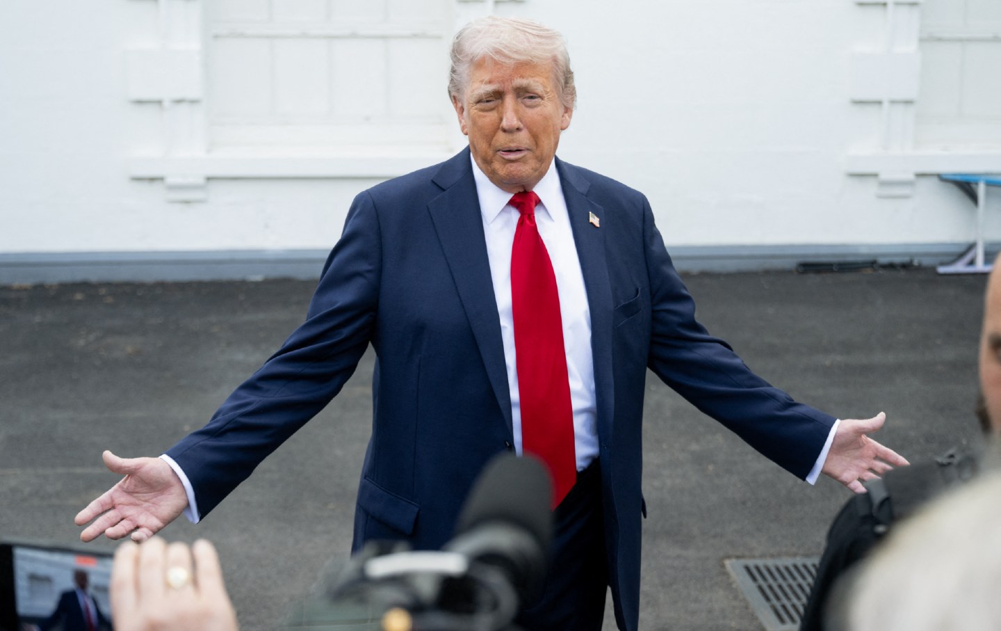 President Donald Trump speaks with reporters outside the White House in Washington, DC, on April 23, 2025.