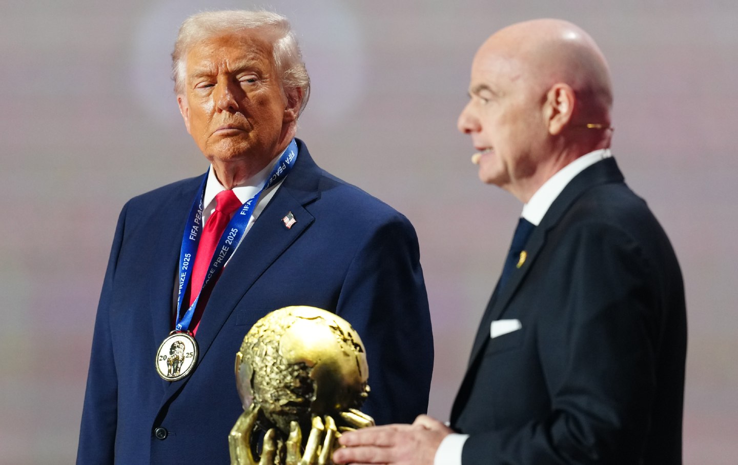 US President Donald Trump receives the FIFA Peace Prize from Gianni Infantino, president of FIFA, during the FIFA World Cup 2026 Official Draw at John F. Kennedy Center for the Performing Arts on December 5, 2025, in Washington, DC.