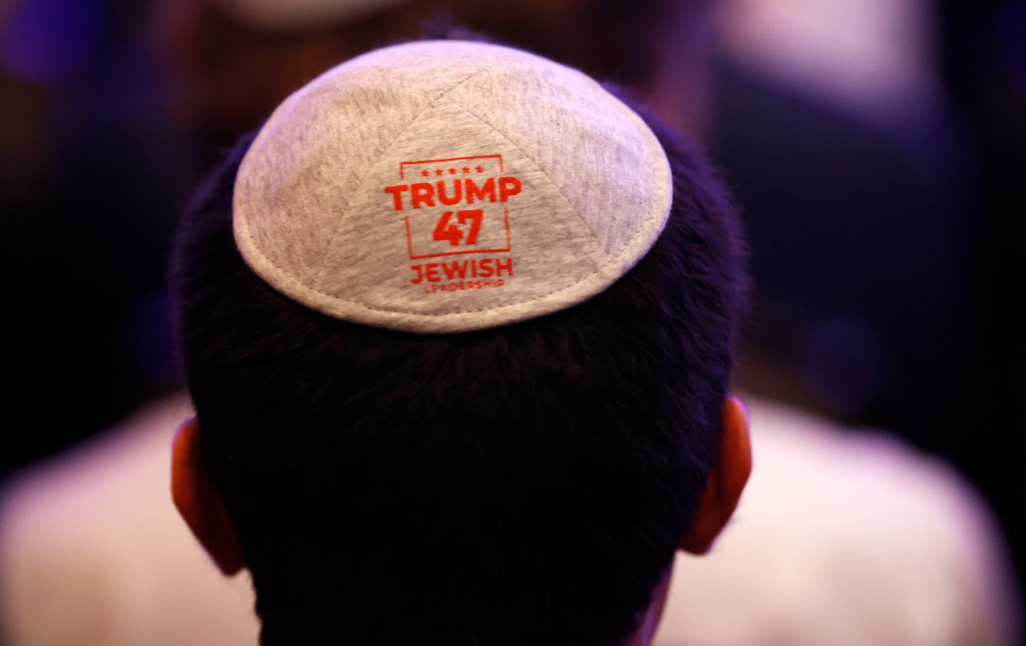 A Jewish student wears a kippah given to him by Donald Trump’s campaign during a speech before prominent Jewish donors on September 19, 2024, in Washington, DC.