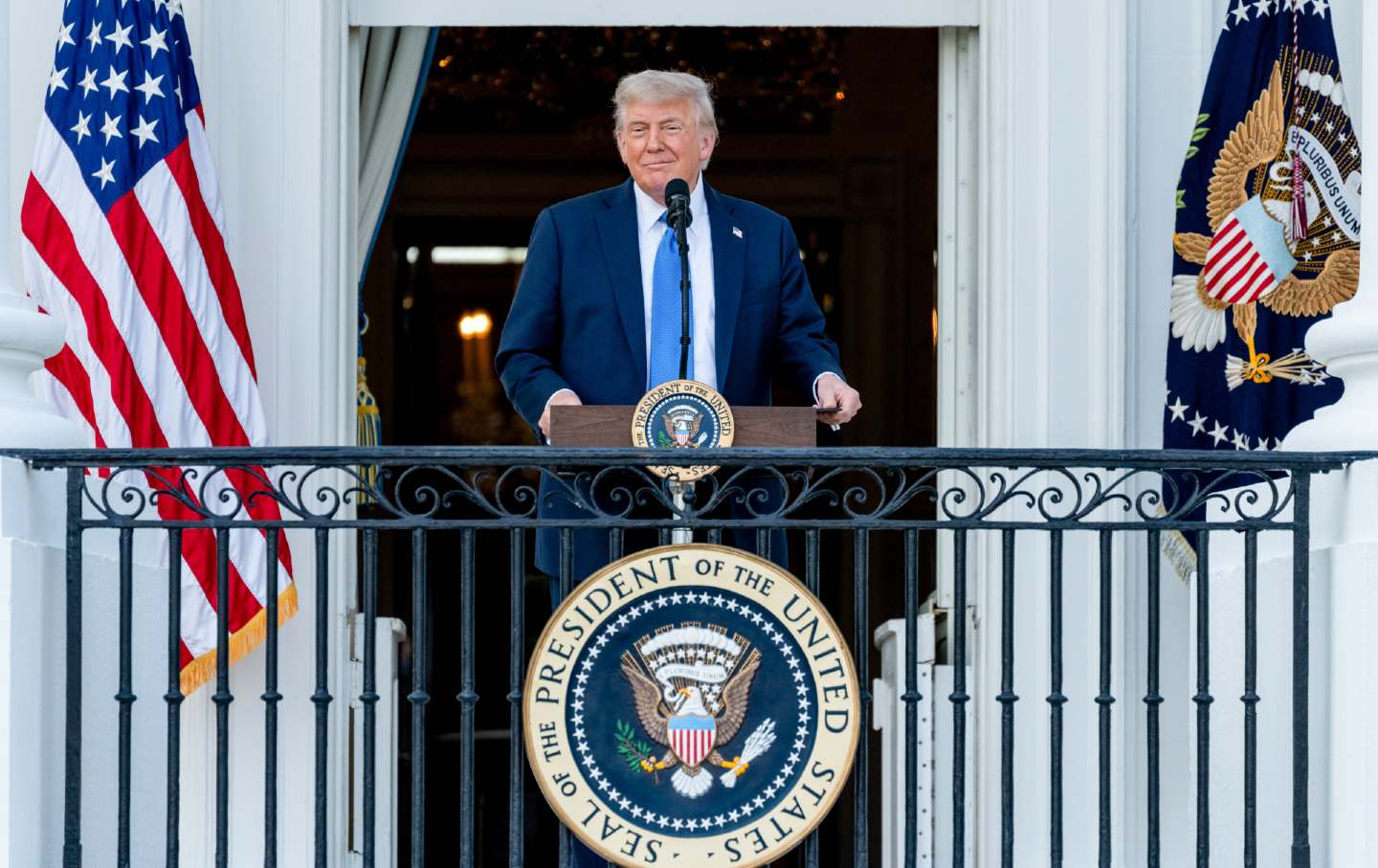 President Donald Trump smirks on the Truman balcony of the White House in Washington, DC, on June 4, 2025.