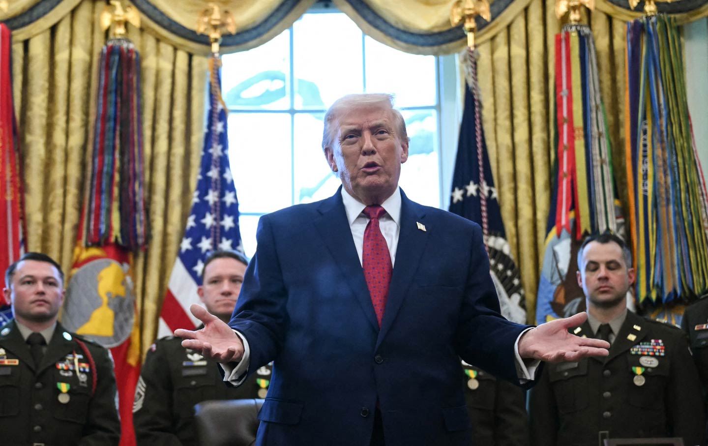 Donald Trump speaks during a Mexican Border Defense Medal presentation in the Oval Office on December 15, 2025.